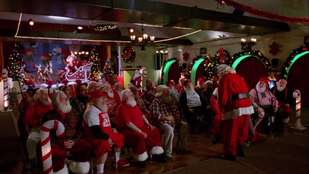 A room full of Santas being trained to laugh
